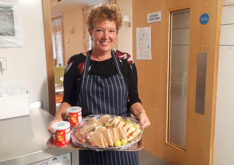 Care home catering staff preparing a meal